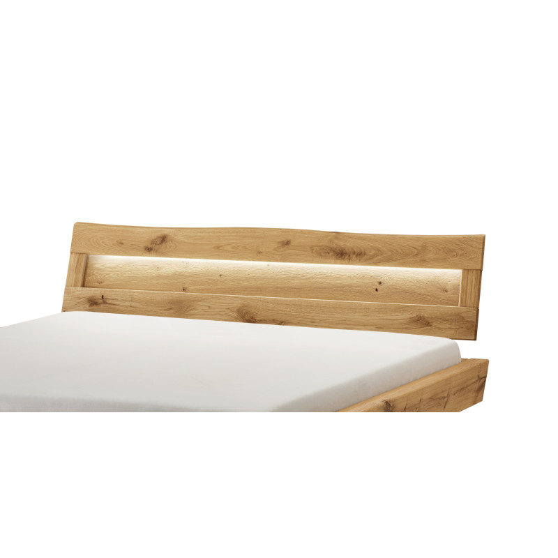 Holzkopfteil mit natürlichem Baumkantenverlauf und Beleuchtung